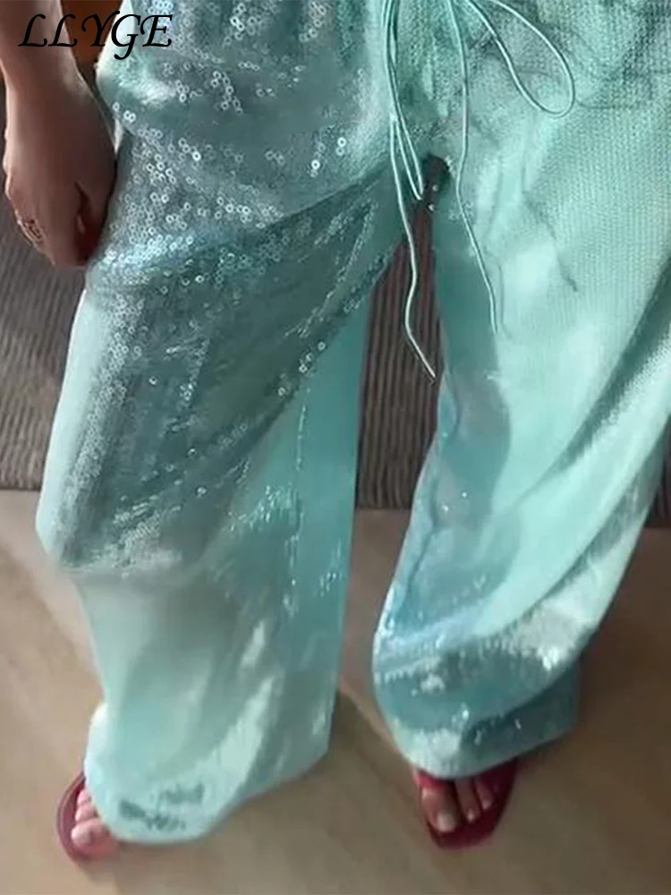 Женские брюки с пайетками и шнуровкой